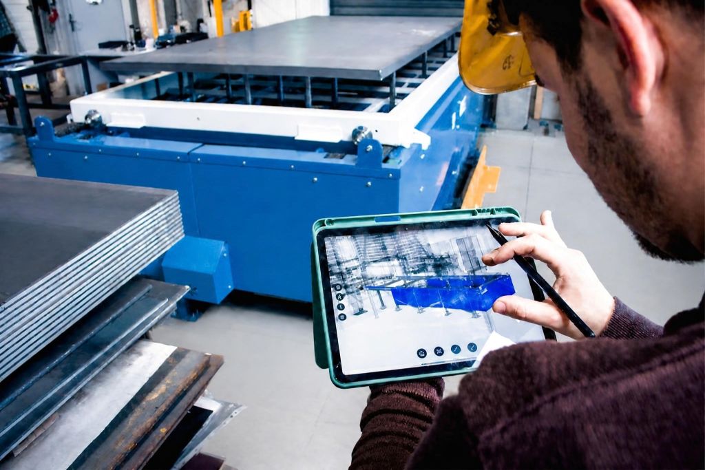 Automated Metal Sheet Storage Tower supplying sheet metal to four punching workstations in a modern manufacturing environment