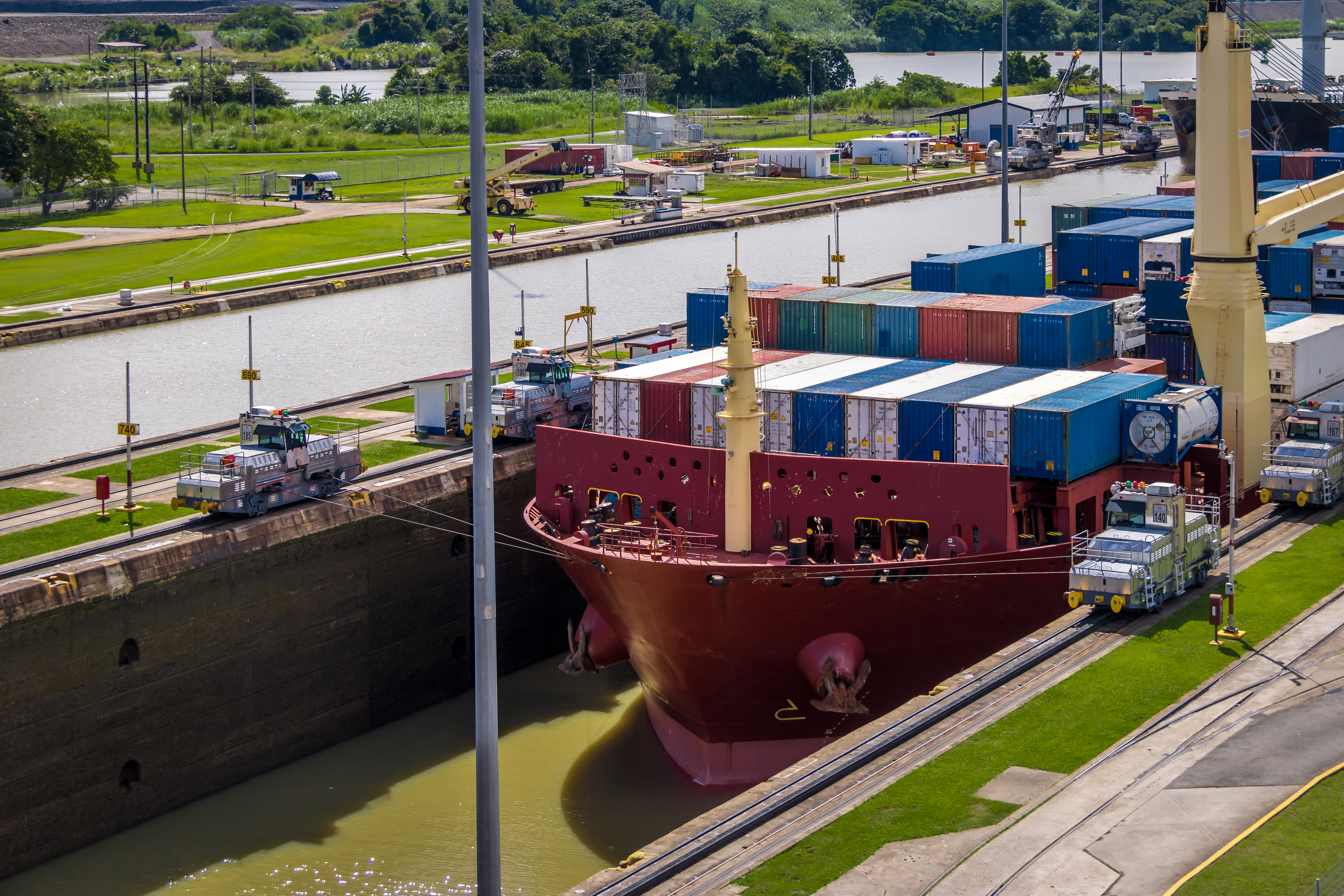 Ship crossing Panama Canal being lowered at Mirafl