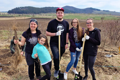 Family planting trees