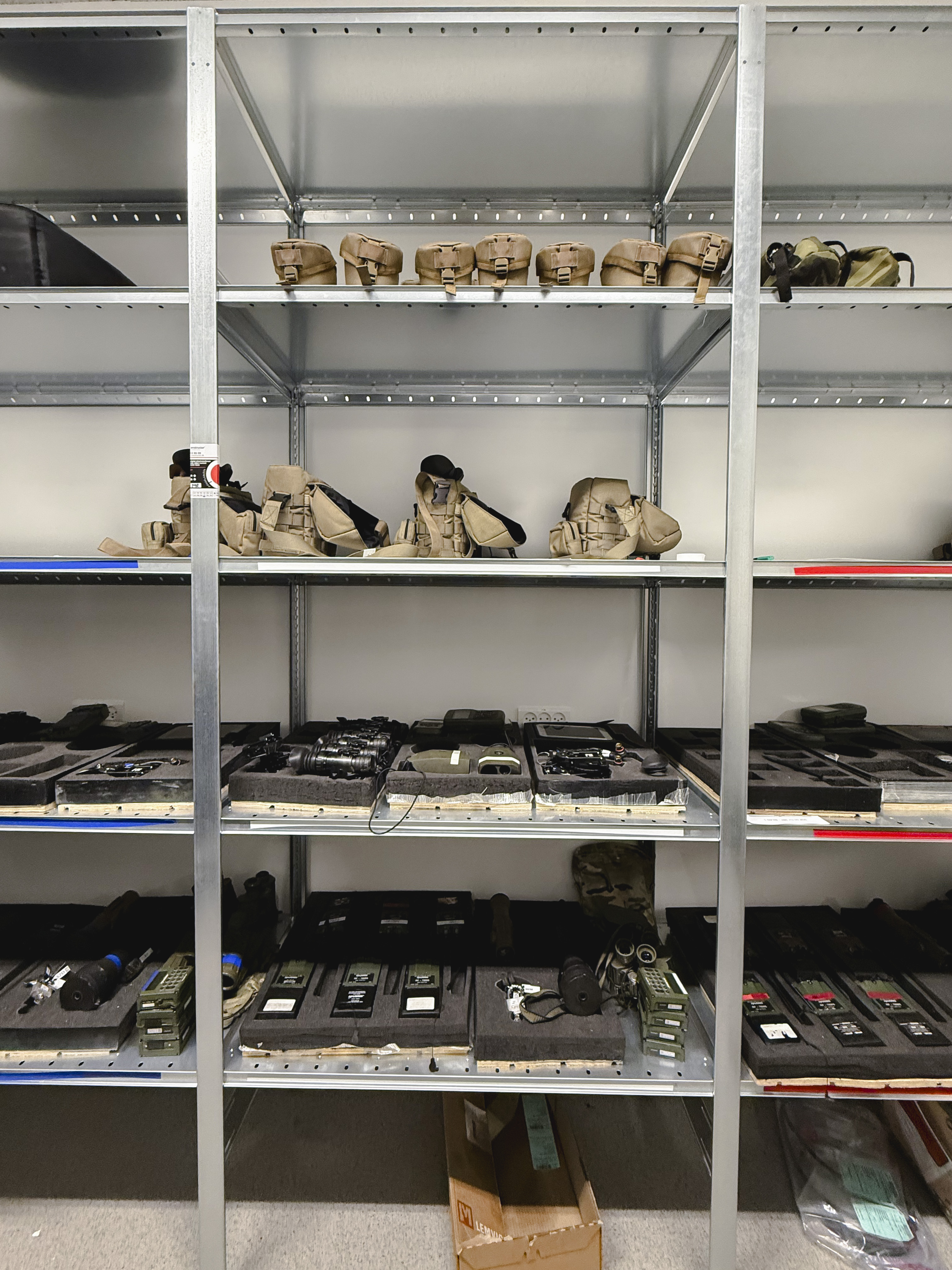 Shelving for weapons and accessories in an armoury